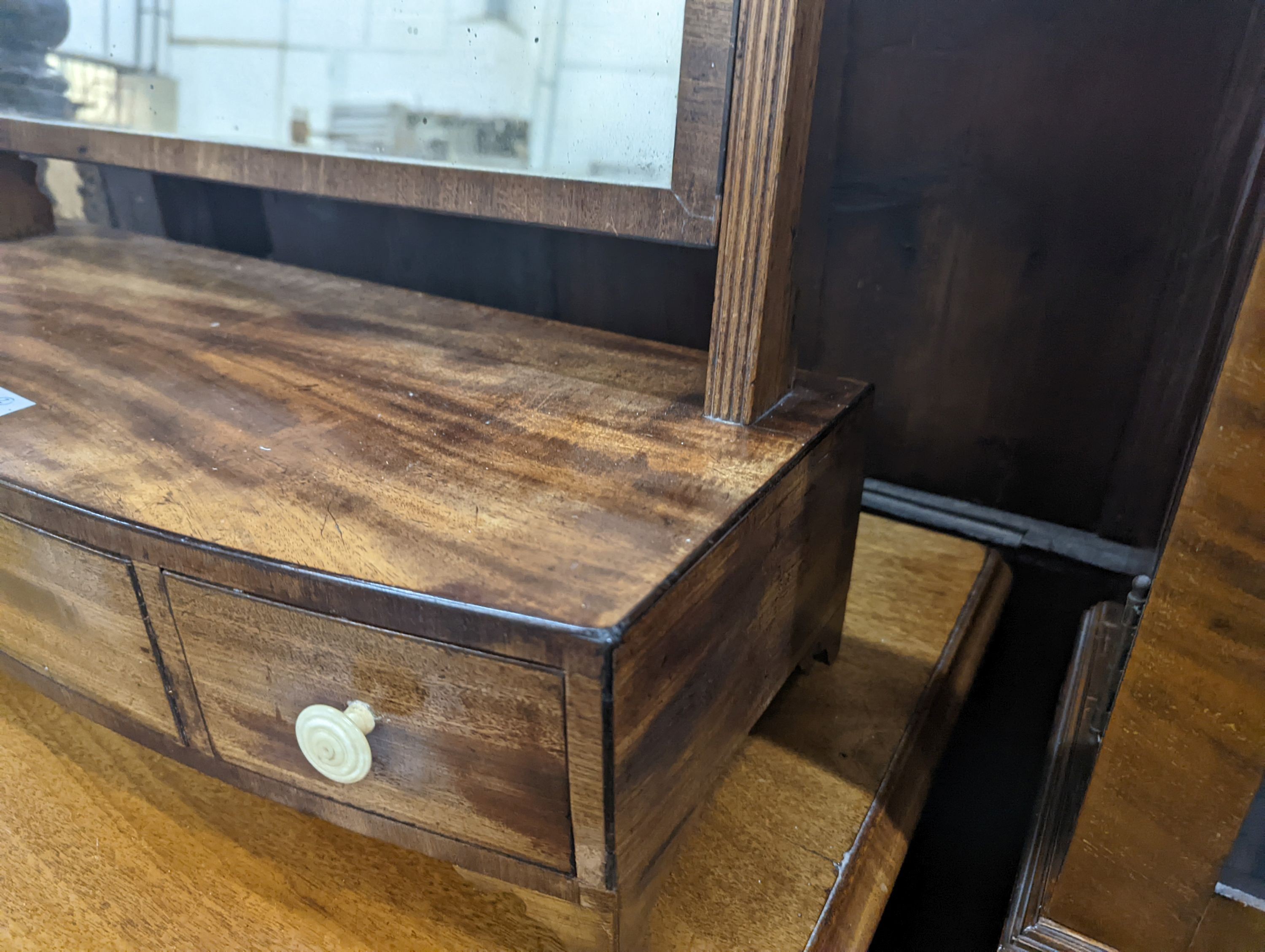 A Regency mahogany bow fronted toilet mirror, width 57cm, height 60cm together with a Regency mahogany tripod wine table